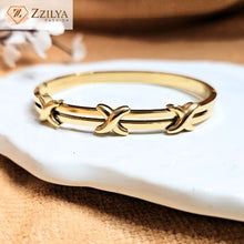 Crossed gold bangle bracelets for women