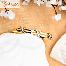 Crossed gold bangle bracelets for women