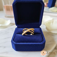 A gold-plated stainless steel triple infinity ring with interlocking stone-studded rows presented in a luxury blue Zzilya Fashion jewelry box.