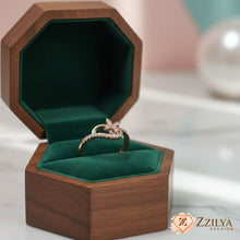 Wooden jewelry box with green interior containing a ring, branded 'Zzilya Fashion'.