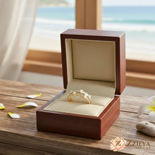 Close-up of a hand wearing two stackable gold rings with white enamel coating and micro-pave diamond accents by Zzilya Fashion.