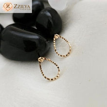 Oval Golden Stud earrings