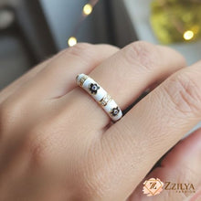 Close-up of a gold daisy flower ring, an ideal adjustable-size gift for her, packaged for spring and summer fashion collections.
