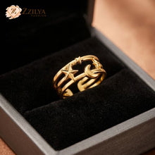 Celestial star and moon gold ring, adjustable anti-tarnish stackable band in a black jewelry box by Zzilya Fashion.