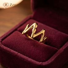 Gold ring in a burgundy jewelry box with 'Zzilya Fashion' branding.