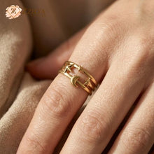 Gold ring with star and moon design on a finger, brand 'zzilya Fashion Jewellery' visible