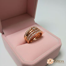 rose gold statement ring featuring four stacked rows of pavé crystals and a central square-cut stone by Zzilya Fashion