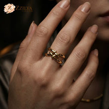 Golden stackable ring on a hand with Zzilya Fashion logo in the corner