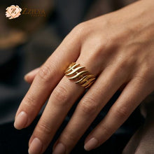 Gold ring on a hand with a blurred background by zzilya Fashion Jewellery