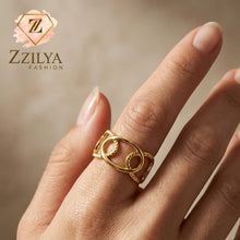 Close-up of a woman's hand wearing a Zzilya Fashion gold interlocking link adjustable ring, minimalist stackable jewelry aesthetic.