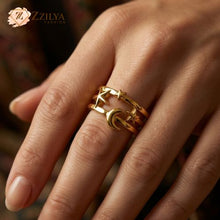 Gold ring on a finger with Zzilya Fashion logo in the corner