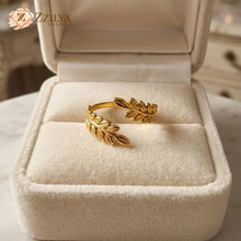 ZZILYA Fashion adjustable golden ring with a detailed olive leaf wrap design, presented in a luxury cream velvet jewelry box.