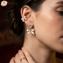 Korean Pearl & Enamel Design.
Elegant Bow Studs - Affordable Luxury.
BEST SELLER
Korean Pearl Bow Earrings
⭐⭐⭐⭐⭐ Quality
Only @ ZzilyaFashion
