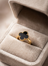 Gold ring with a black Enamel Clover  in a beige jewelry box by Zzilya Fashion
