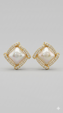 Pair of square-shaped gold stud earrings featuring a raised mother-of-pearl center and a geometric pavé crystal border by Zzilya Fashion.