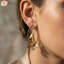 Close-up of a person wearing golden earrings by zzilya fashion Pinterest Inspired jewelery for Gen Z