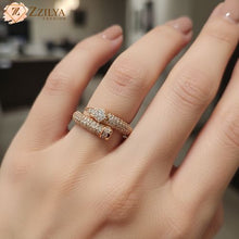 Close-up of adjustable rose gold wrap ring in a hand, high-resolution photorealistic jewelry photography, anti-tarnish aesthetic fashion accessory by zzilya fashion.