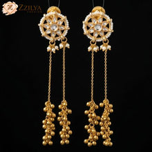 Traditional gold-plated Kashmiri Dejhoor style long chain earrings with Kundan floral studs and pearl droplets from Zzilya Fashion.
