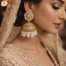 Close-up of a woman wearing Royal Pink Jhumka by Zzilya fashion