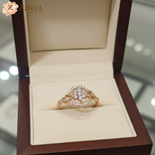 Rose gold ring with diamonds in a wooden box, branded 'ZZILYA'.
