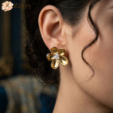 ZZILYA Fashion polished gold-tone anti-tarnish flower stud earring on a woman’s ear, featuring 5 wide, smooth petals and a central oval cz diamond, perfect for professional daily wear.