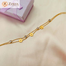 Elegant floral charm bracelet with daisy accents and sparkling stones, perfect for everyday and festive wear