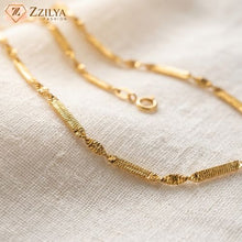 Zzilya Fashion anti-tarnish gold neckchain featuring alternating textured rectangular bars and twisted decorative links on a clean white background.