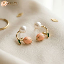 Pair of gold earrings with pearls and pink stones by zzilya fashion under rs  99