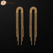 Zzilya Fashion golden rhinestone long statement earrings for ₹99.