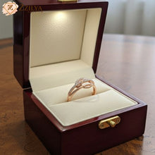 Elegant intertwined rose gold ring on a finger, photorealistic 8K quality jewelry photography, minimalist Pinterest-style fashion accessory.