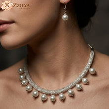 A close-up image showing a woman wearing a shimmering silver beaded choker necklace adorned with hanging white pearls and a matching pearl drop earring from Zzilya Fashion, available for 99 rupees.