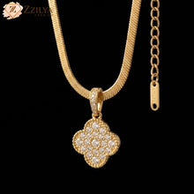 Zzilya Fashion high-quality golden snake chain necklace with a sparkling cubic zirconia stone-studded clover pendant; anti-tarnish minimalist jewelry for women, 2026 fashion trend.