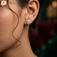 Close-up of a woman wearing a Zzilya Fashion gold star-shaped earring studded with clear, brilliant-cut stones, showcasing a minimalist and elegant jewelry style for everyday use.